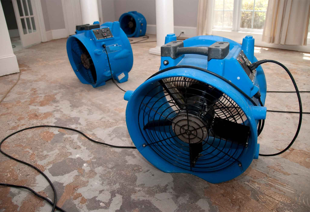 Industrial Fans Drying a Home Damaged by Water