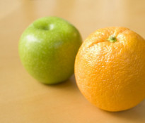 An Apple and Orange on a Table
