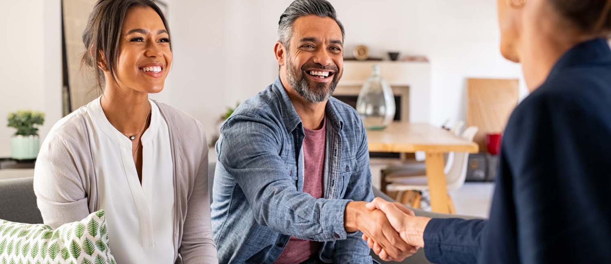 Two Homeowners Meeting With an Adjuster